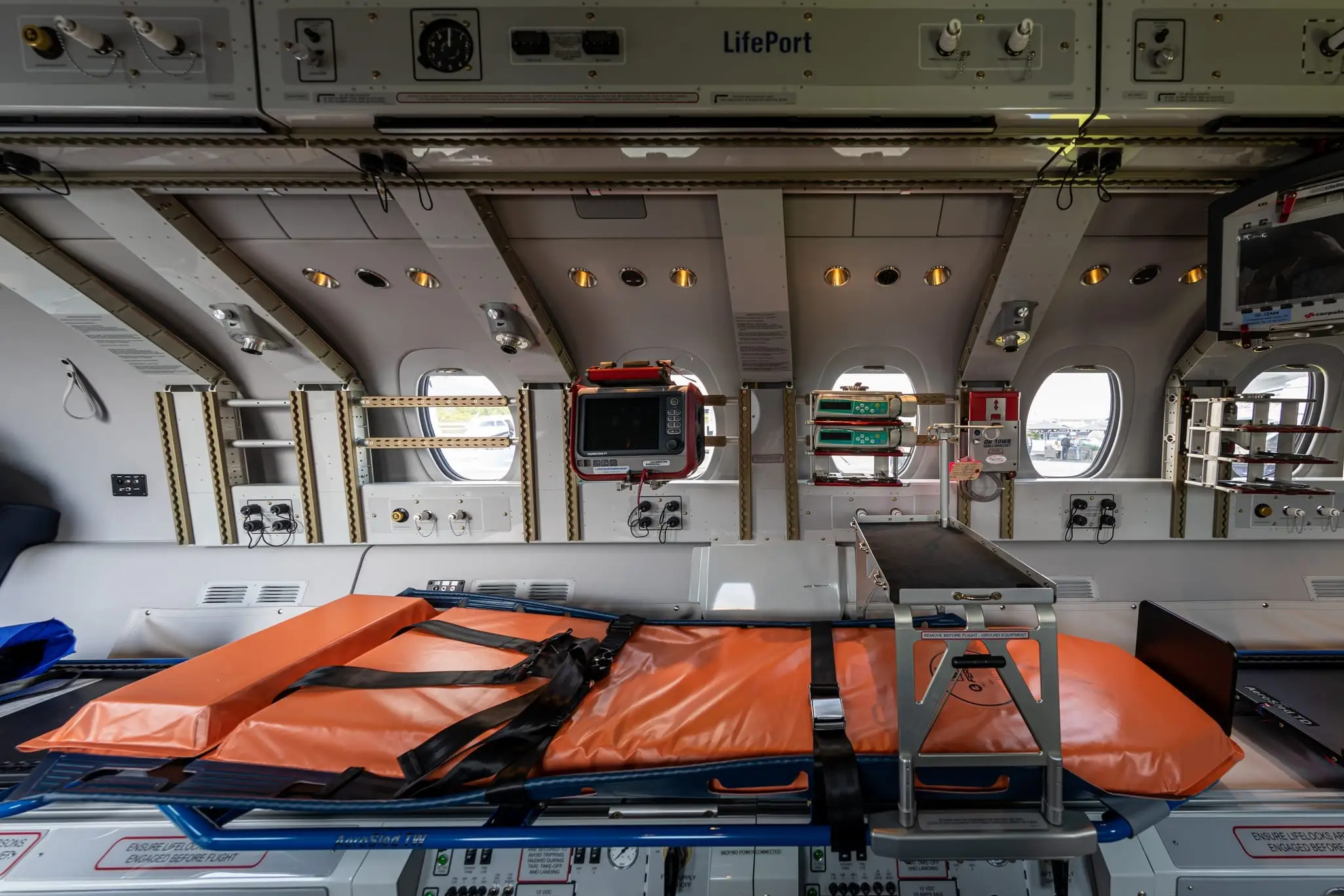 A stretcher and medical equipment fitted into a turboprop cabin