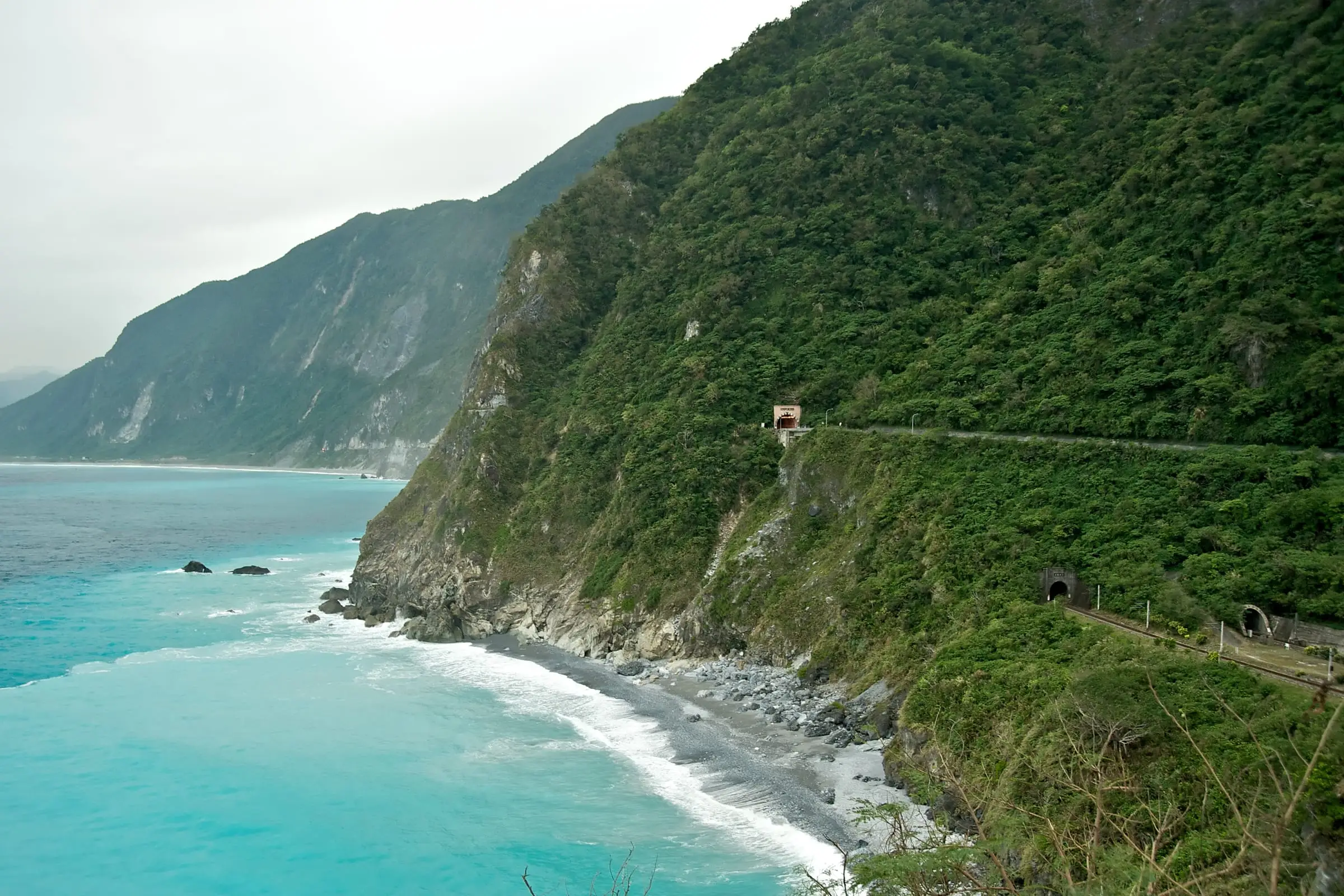 Steep cliffs falling directly into deep water along an exposed coast