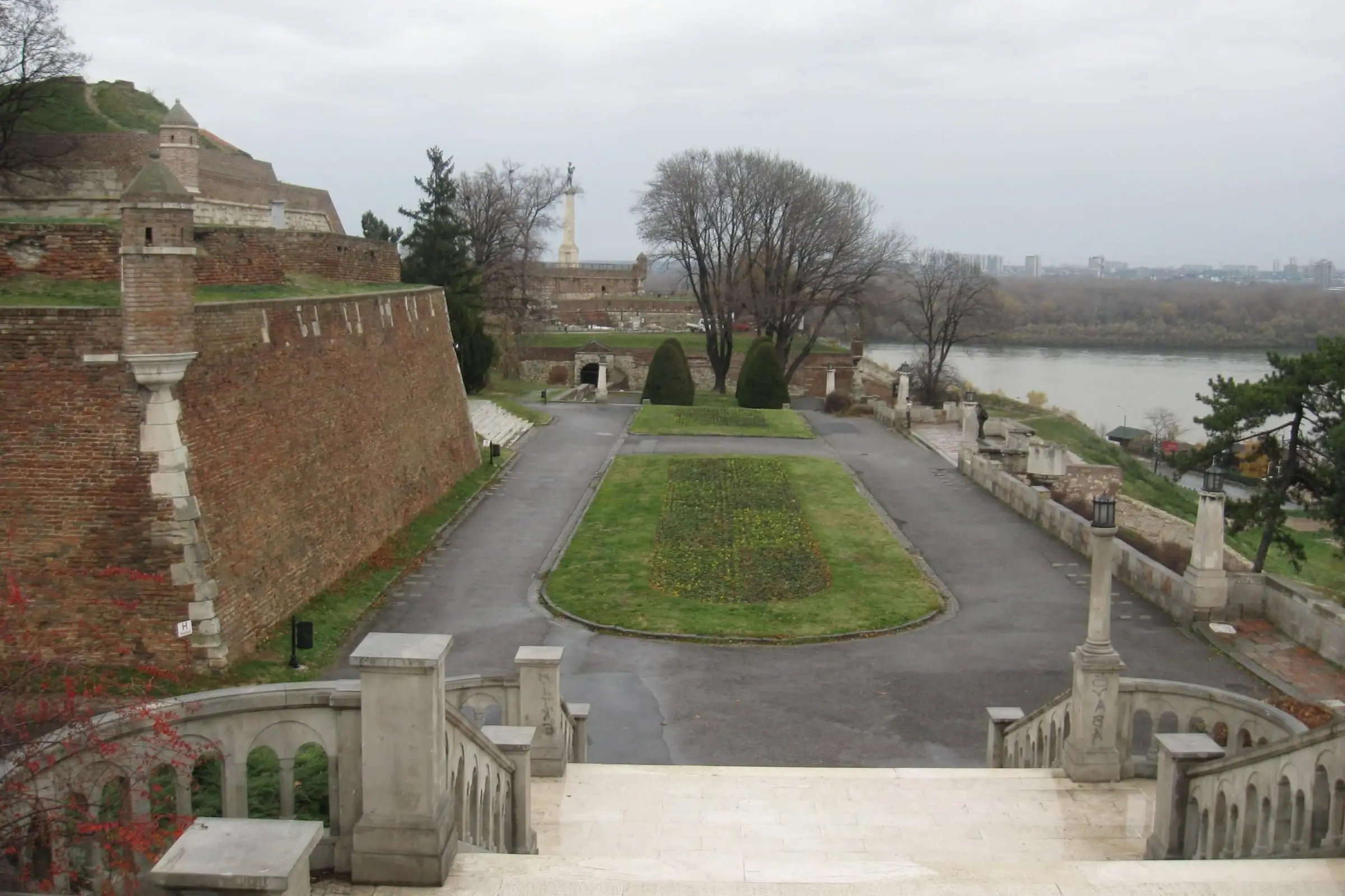 A large river seen from a fortified bluff above its confluence