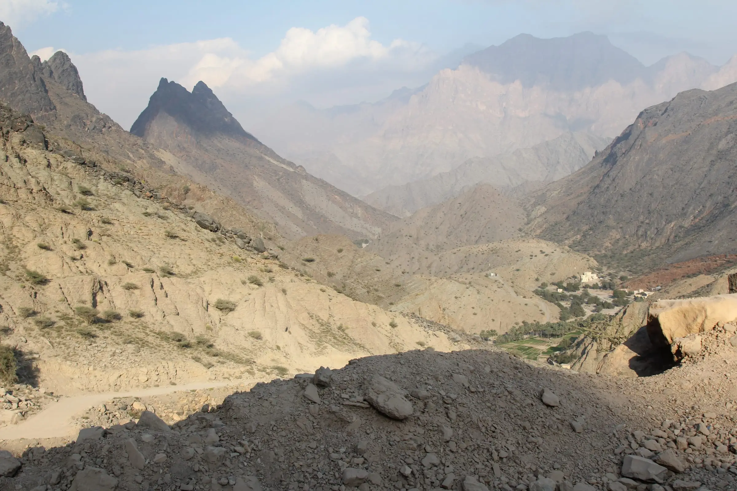A steep rocky wadi cutting between arid mountain ridges