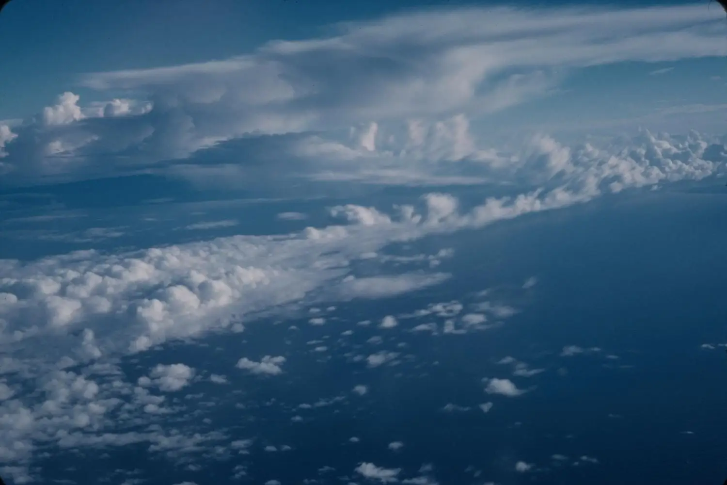 Scattered low islands and reef in open ocean seen from altitude